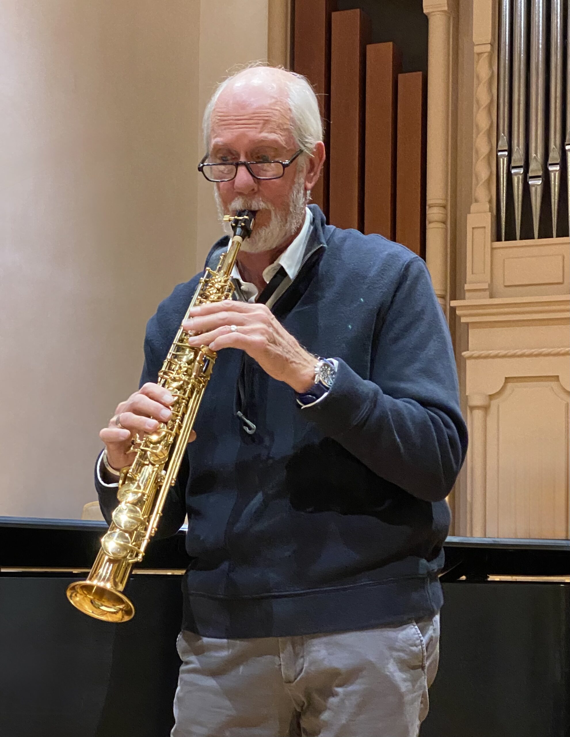 Man playing shiny gold soprano saxophone